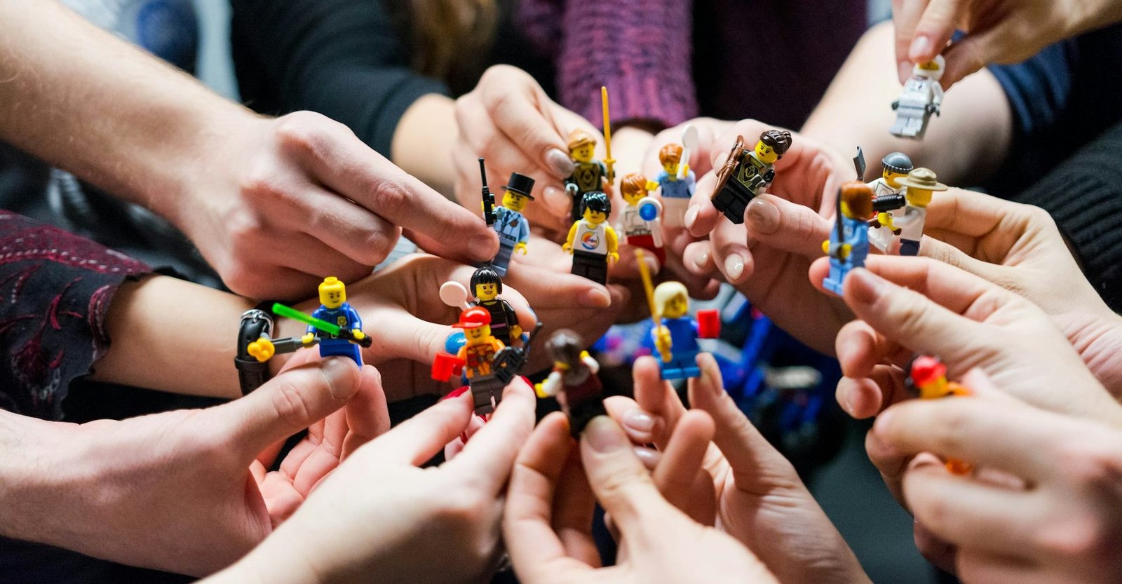 People holding Lego Toys